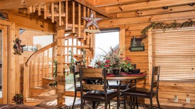 interior of log home with spiral staircase