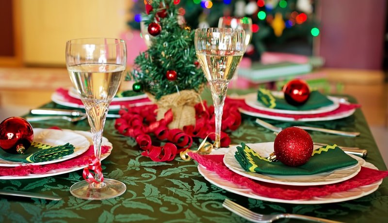 Christmas table settings with wine glasses