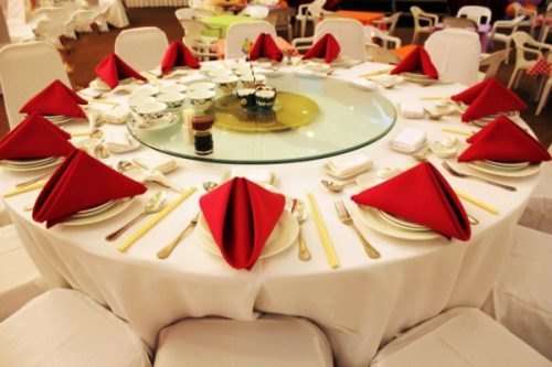 Round table with red napkins