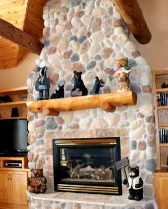 bears on a fireplace mantle of a stone fireplace