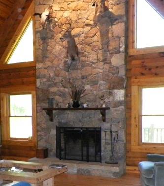 hunting trophies above a fireplace mantle