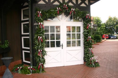 garland with lights around an entry door