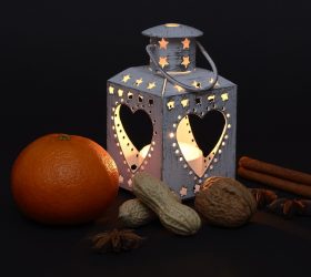 Candle in lantern with heart shaped cut-outs