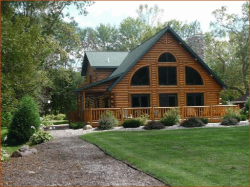 Modern log cabin kit home with green roof