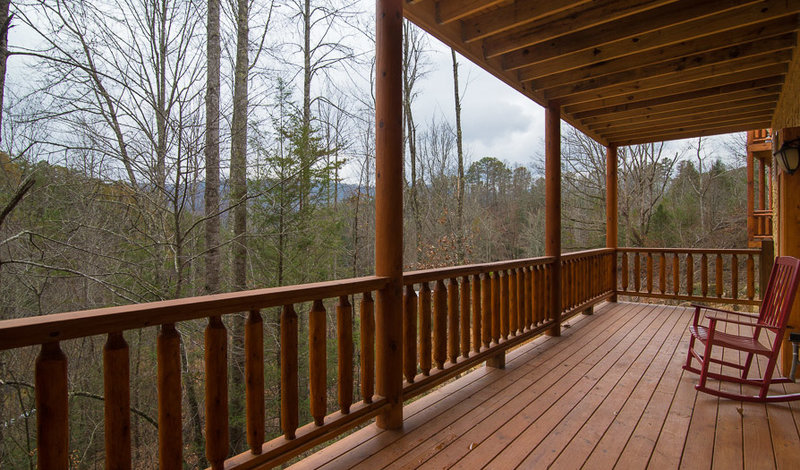 log railing on porch of log home