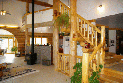 half round stairs with shelves in a log home
