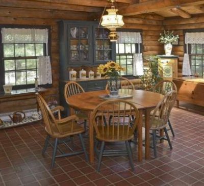 pendant over dining table in a log home