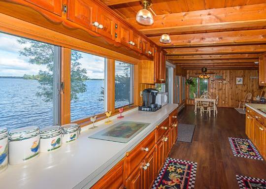 wall of windows in a log home kitchen