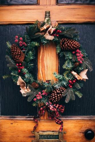 Christmas wreath on rustic door