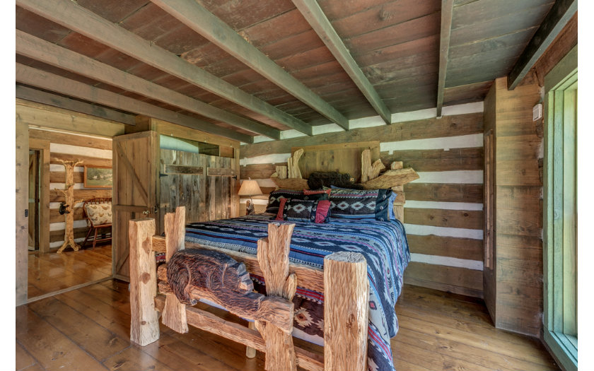 cabin bedding on carved log bed