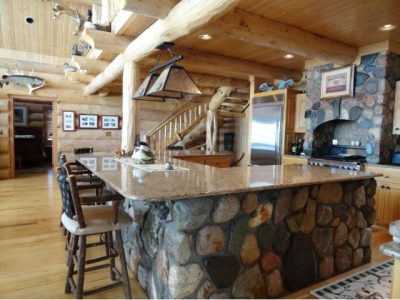stone island in log home kitchen
