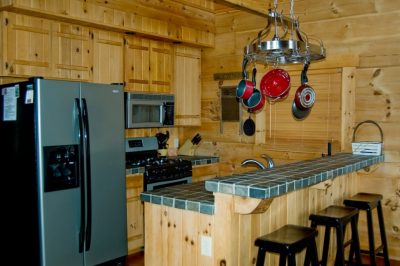 log cabin kitchen with pot rack