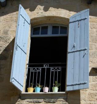 light blue shutters with locks on the inside