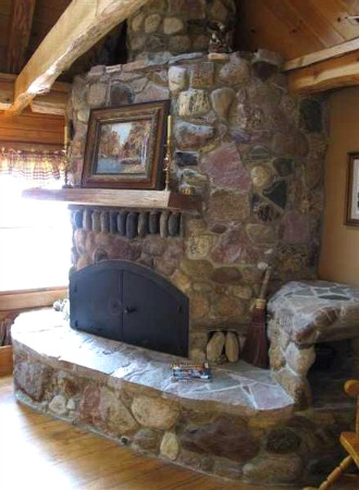 rustic stone fireplace with insert