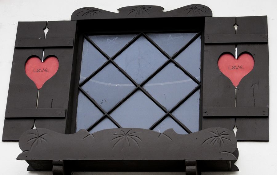 rustic brown shutters with red hearts